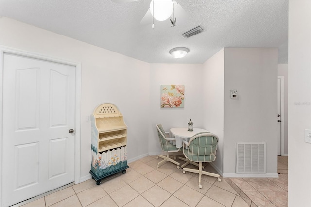 1202 San Bernardo Rd, The Villages, FL 32162 - dining area featuring light tile patterned floors, visible vents, and a textured ceiling