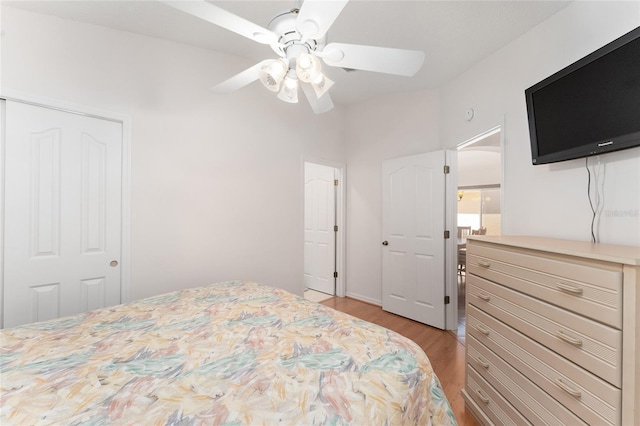 1202 San Bernardo Rd, The Villages, FL 32162 - bedroom with light wood-style floors and ceiling fan