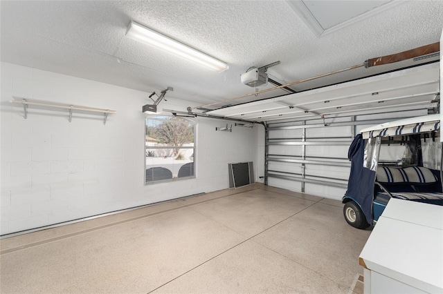 1202 San Bernardo Rd, The Villages, FL 32162 - garage featuring concrete block wall and a garage door opener