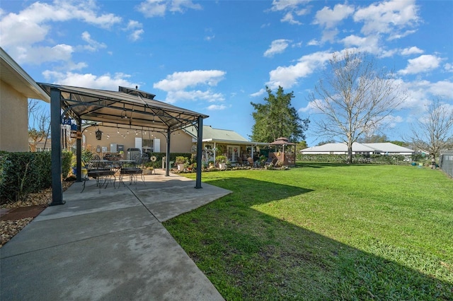 view of yard with a patio and a gazebo