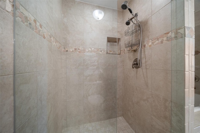 bathroom with tiled shower