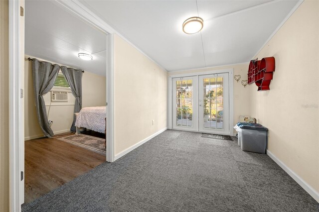 unfurnished bedroom featuring access to exterior, baseboards, carpet flooring, and french doors