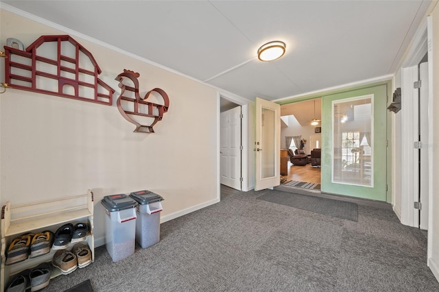 spare room with ornamental molding, french doors, carpet flooring, and baseboards