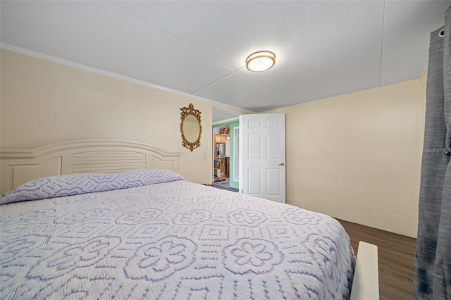 bedroom featuring dark wood-style floors