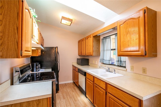 kitchen with dishwasher, stainless steel electric range oven, light countertops, black microwave, and a sink