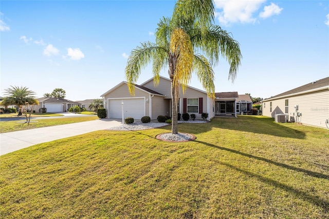 single story home with a garage, concrete driveway, a front lawn, and central air condition unit