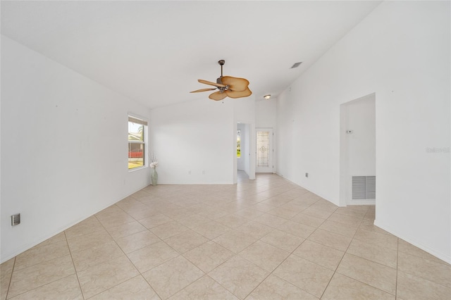 spare room with light tile patterned floors, high vaulted ceiling, visible vents, and a ceiling fan