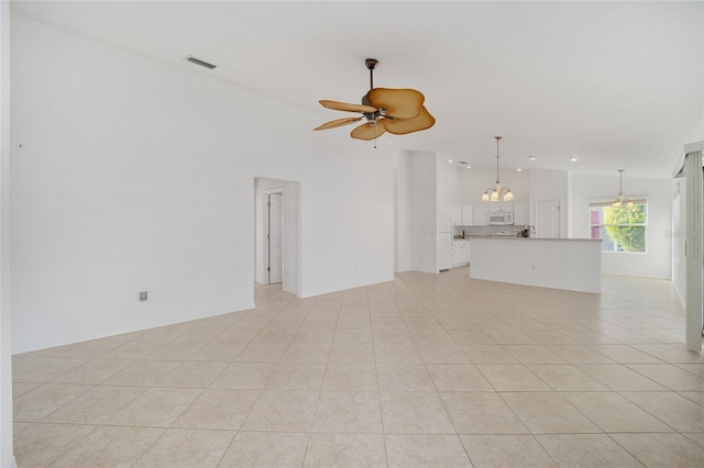 unfurnished living room featuring light tile patterned floors, visible vents, high vaulted ceiling, and ceiling fan with notable chandelier