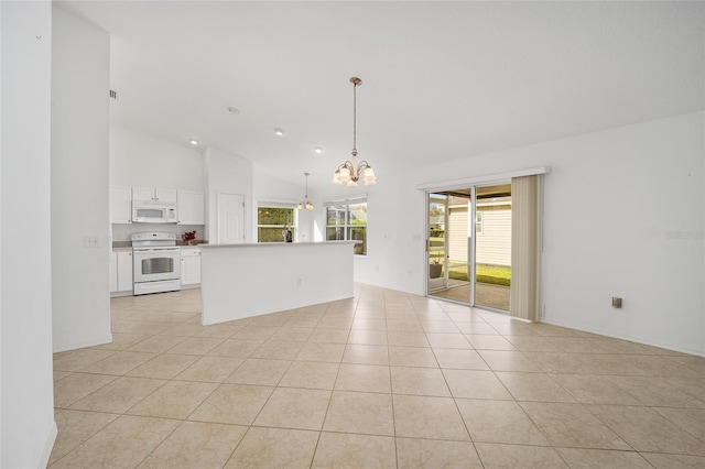 interior space with a chandelier, high vaulted ceiling, and light tile patterned flooring