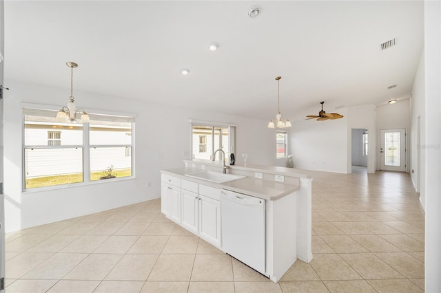 kitchen featuring visible vents, dishwasher, a sink, and light tile patterned floors