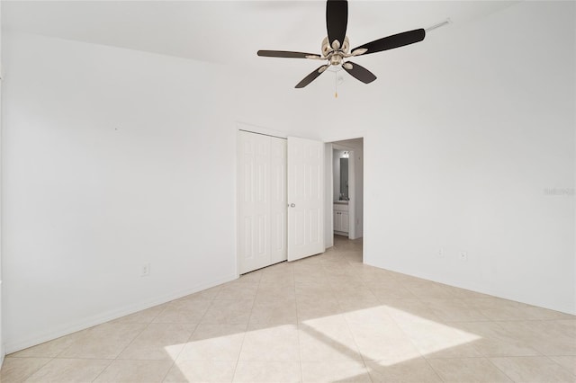 unfurnished room featuring baseboards and light tile patterned floors