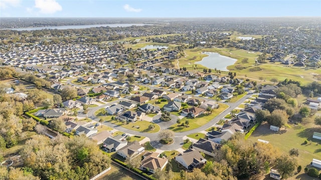 bird's eye view featuring a water view and a residential view