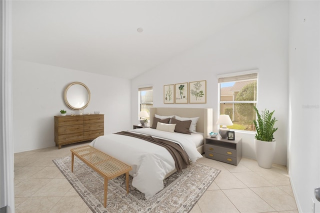 bedroom featuring light tile patterned floors and high vaulted ceiling