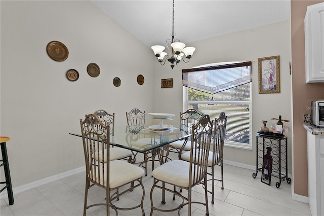 dining space with lofted ceiling, light tile patterned floors, baseboards, and a notable chandelier