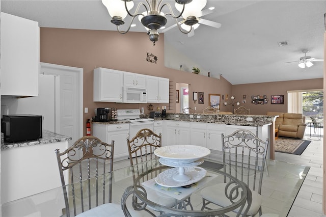 dining room featuring ceiling fan with notable chandelier, high vaulted ceiling, light tile patterned floors, and visible vents