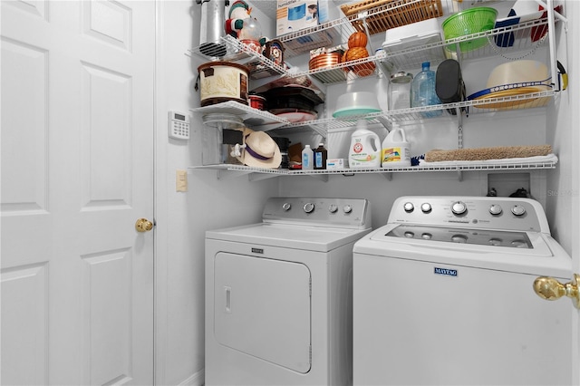 laundry area with laundry area and washer and clothes dryer