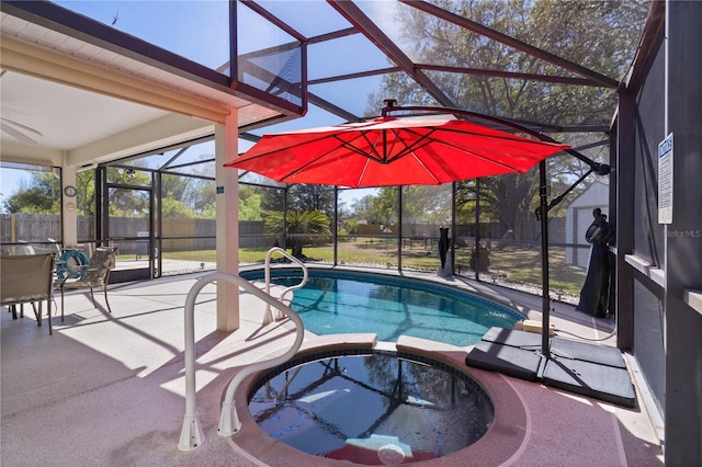 view of swimming pool with a pool with connected hot tub, a lanai, a patio area, and fence