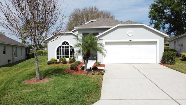 single story home featuring an attached garage, a front lawn, concrete driveway, and stucco siding