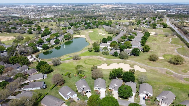 bird's eye view featuring view of golf course, a water view, and a residential view