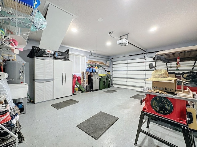 garage with a garage door opener and water heater