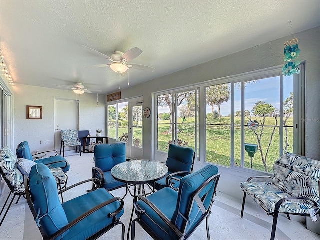 sunroom / solarium with ceiling fan