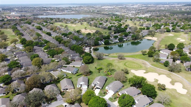 bird's eye view with a residential view, view of golf course, and a water view