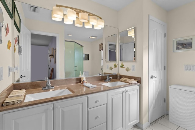 full bathroom with tile patterned flooring, a shower stall, visible vents, and a sink