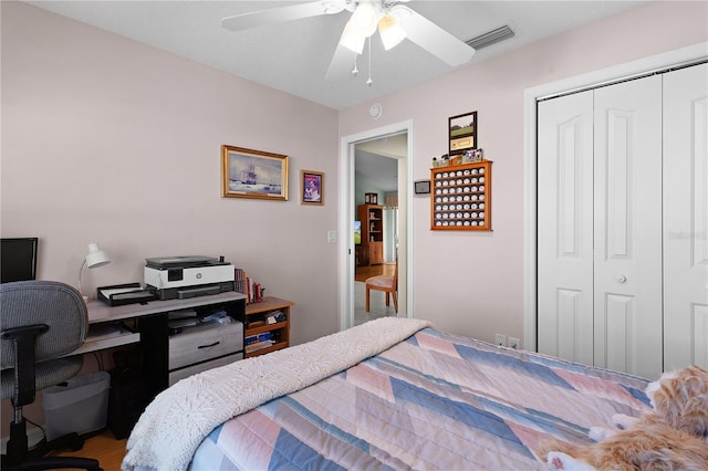 bedroom featuring a ceiling fan, a closet, and visible vents