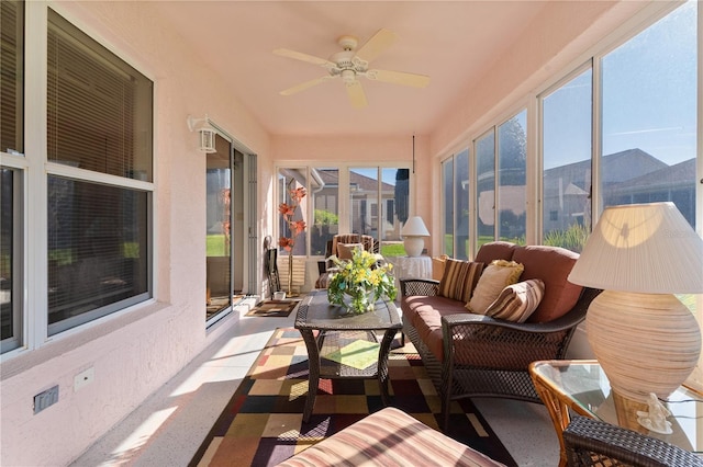 sunroom featuring a ceiling fan