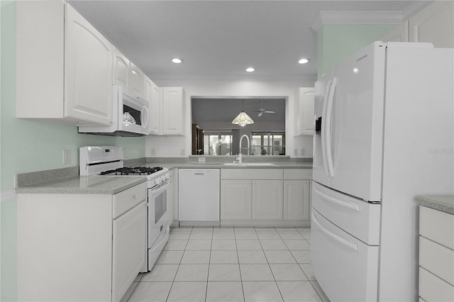 kitchen with white cabinetry, a sink, light countertops, recessed lighting, and white appliances