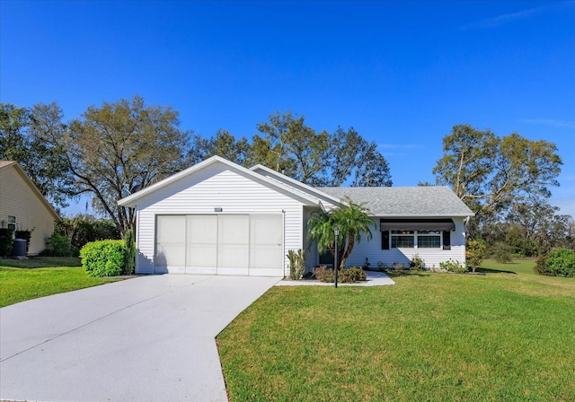 ranch-style home with a garage, driveway, a front lawn, and a shingled roof