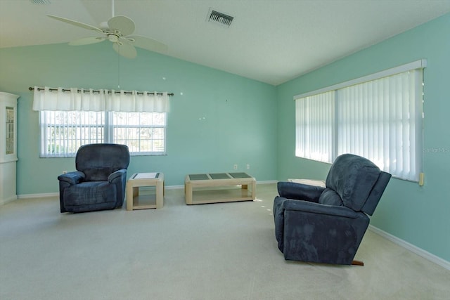 sitting room featuring plenty of natural light, visible vents, and vaulted ceiling