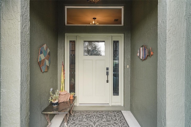 2124 Biller Cir, The Villages, FL 32163 - doorway to property featuring stucco siding