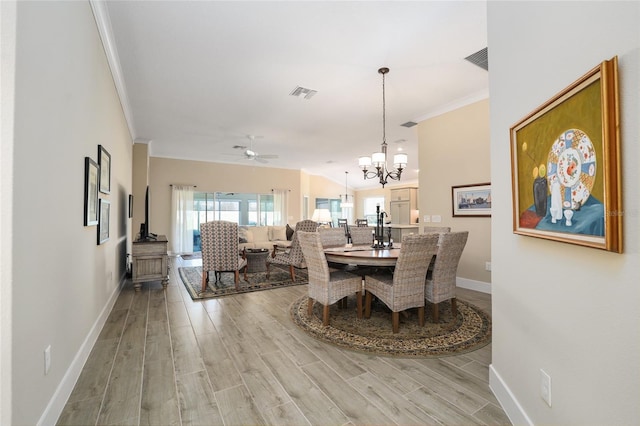 2124 Biller Cir, The Villages, FL 32163 - dining space with baseboards, light wood-type flooring, visible vents, and crown molding