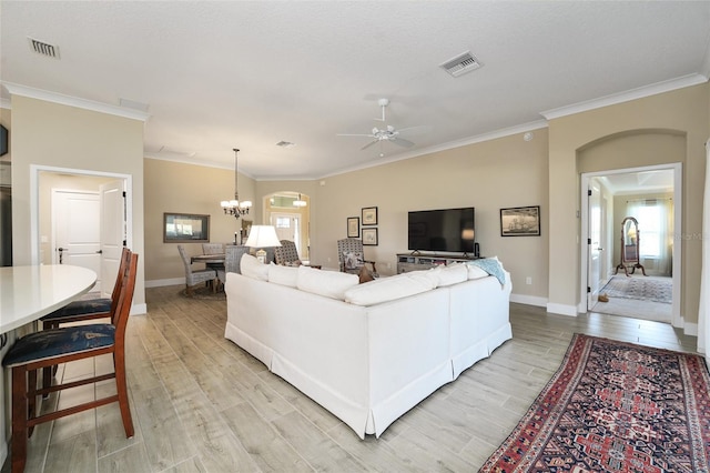 2124 Biller Cir, The Villages, FL 32163 - living room featuring light wood-style floors, visible vents, crown molding, and baseboards