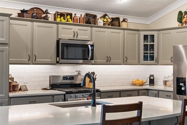 2124 Biller Cir, The Villages, FL 32163 - kitchen with light countertops, appliances with stainless steel finishes, and decorative backsplash