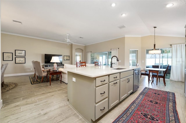 2124 Biller Cir, The Villages, FL 32163 - kitchen with a sink, visible vents, vaulted ceiling, light countertops, and stainless steel dishwasher
