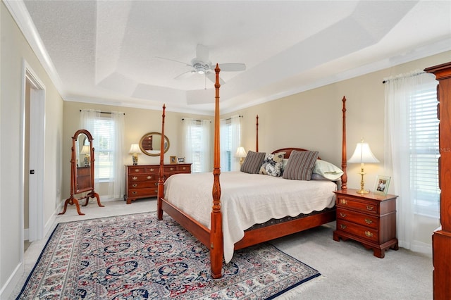2124 Biller Cir, The Villages, FL 32163 - bedroom with ceiling fan, light colored carpet, baseboards, a raised ceiling, and crown molding