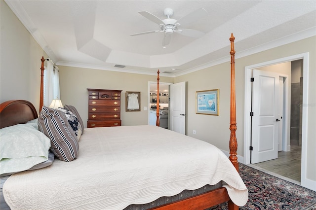 2124 Biller Cir, The Villages, FL 32163 - bedroom with a tray ceiling, crown molding, visible vents, a ceiling fan, and wood finished floors