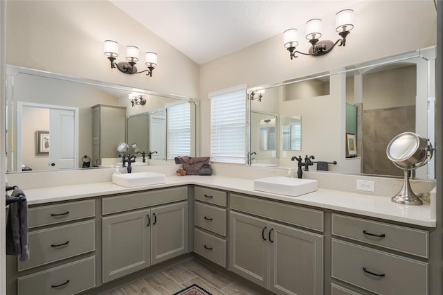 2124 Biller Cir, The Villages, FL 32163 - bathroom with lofted ceiling, a sink, and double vanity