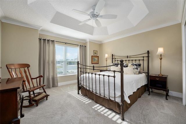 2124 Biller Cir, The Villages, FL 32163 - bedroom featuring a textured ceiling, carpet flooring, baseboards, ornamental molding, and a raised ceiling