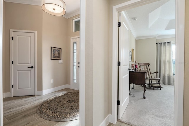 2124 Biller Cir, The Villages, FL 32163 - entrance foyer featuring baseboards, ornamental molding, and wood finished floors