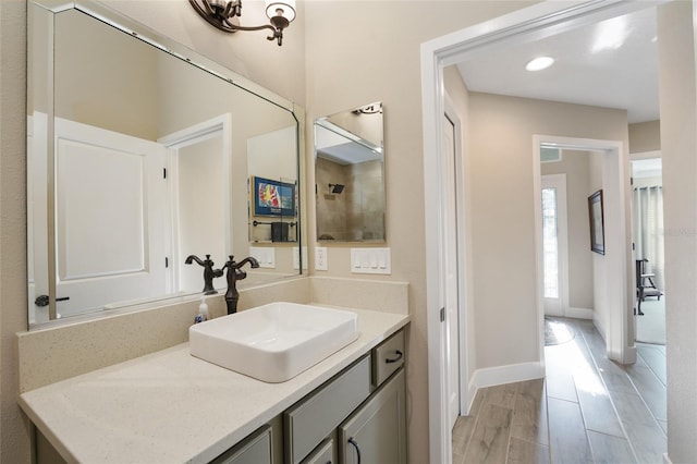 2124 Biller Cir, The Villages, FL 32163 - bathroom featuring wood finished floors, vanity, and baseboards