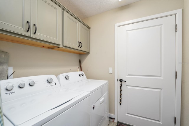 2124 Biller Cir, The Villages, FL 32163 - laundry room with washer and dryer, cabinet space, and a textured ceiling