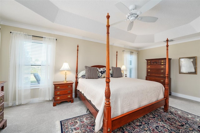 2124 Biller Cir, The Villages, FL 32163 - bedroom featuring ornamental molding, multiple windows, carpet flooring, and a raised ceiling