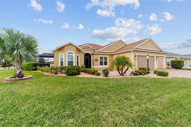 view of front of house featuring stucco siding, driveway, glass enclosure, a front yard, and a garage