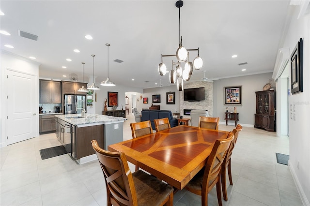 dining area featuring recessed lighting, a fireplace, and visible vents