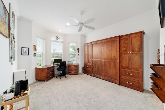 office space featuring ceiling fan, crown molding, baseboards, and light carpet