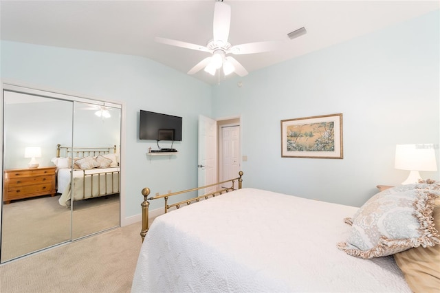 bedroom with lofted ceiling, ceiling fan, visible vents, and light colored carpet