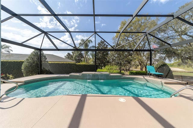 pool with a patio and glass enclosure